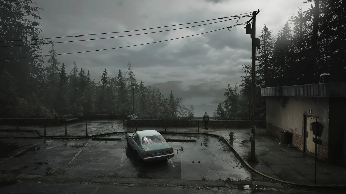 Rua com névoa e carros abandonados em Silent Hill 2